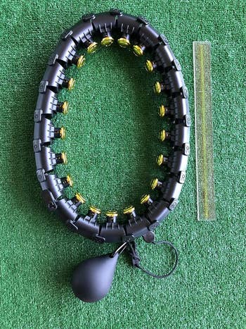 reviewer image of the black and gold weighted hoop