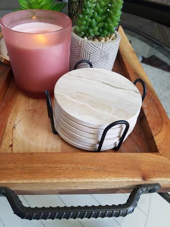 reviewer photo of white marble ceramic coasters in holder