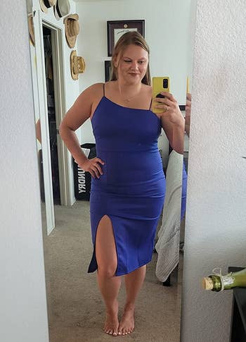 reviewer in the spaghetti strap blue midi dress