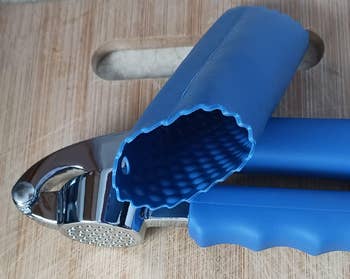 A ail  property   with a textured silicone grip  rests connected  a woody  surface