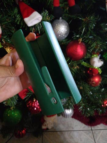 a reviewer shows a close up of the green cutter