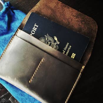 reviewer photo of passport in leather holder