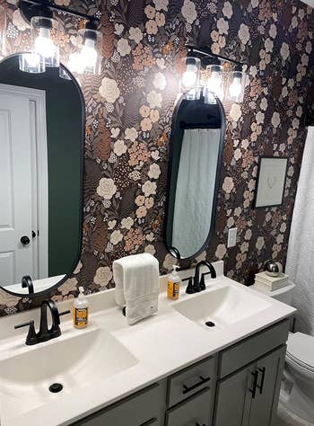 another reviewer showing the floral wallpaper installed on their bathroom wall