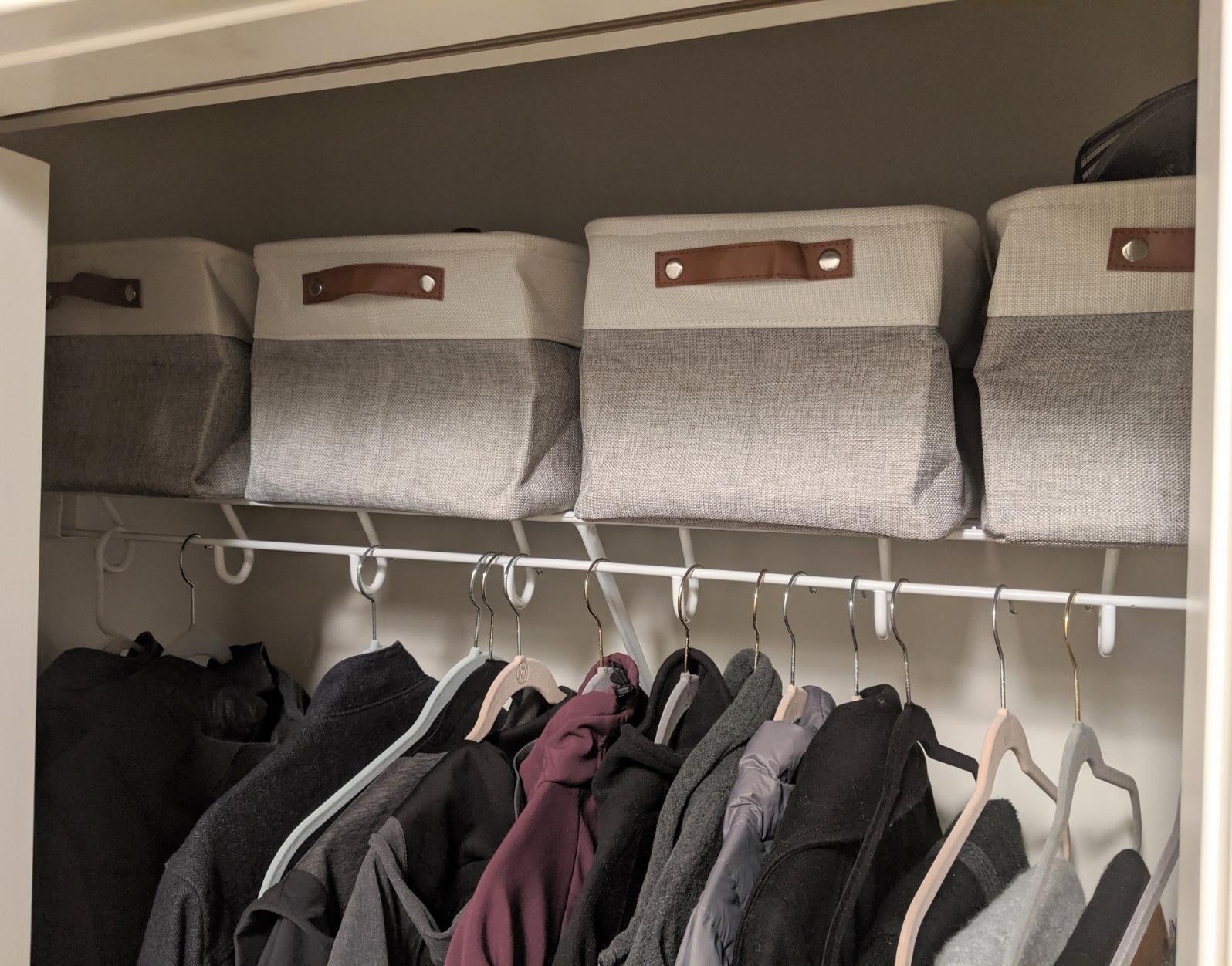 reviewer image of four bins on the top shelf of a closet