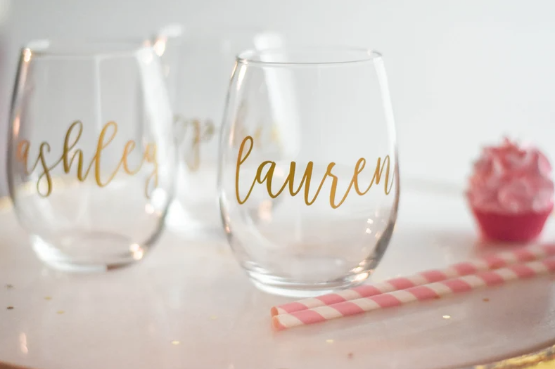 Image of two wine glasses with the names 