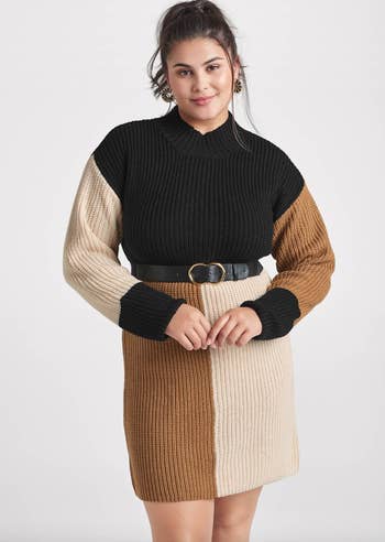 model wearing belted, beige and black colorblock sweater dress