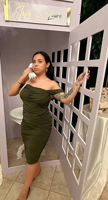 reviewer wearing the dress in olive green