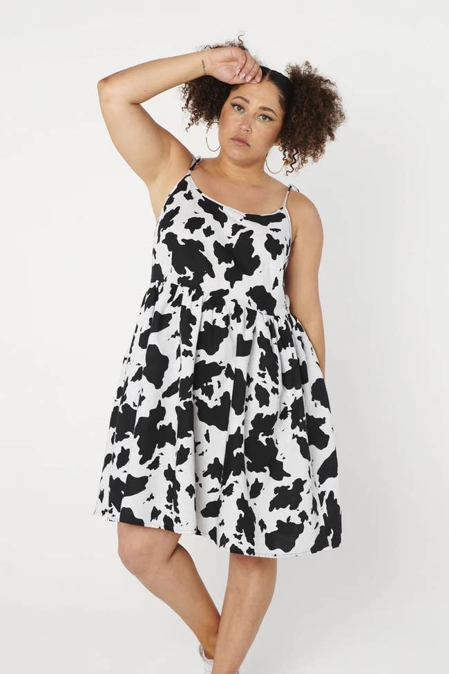 model with cow print spaghetti strap dress
