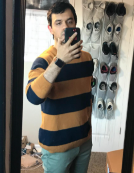 reviewer mirror selfie while wearing the striped sweater
