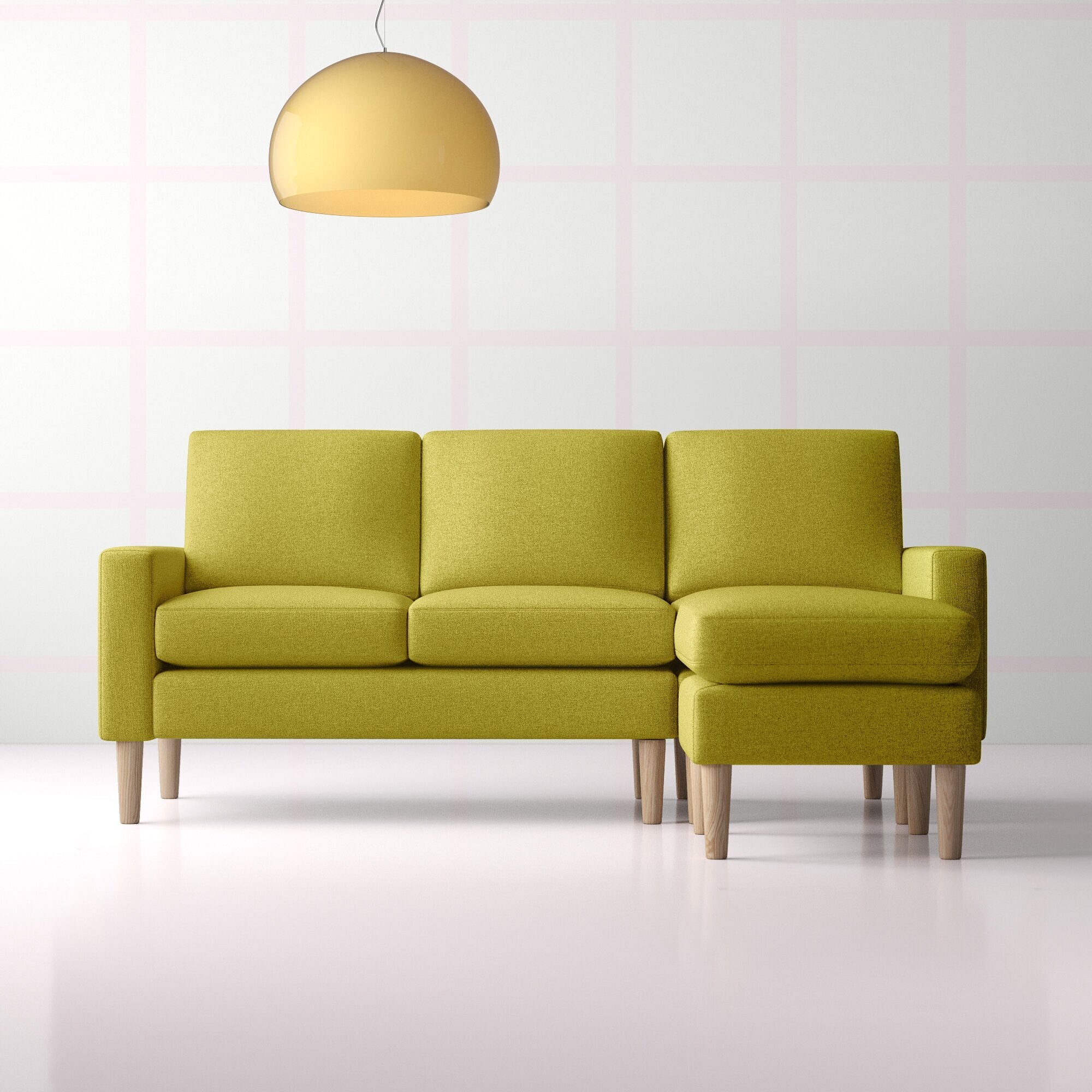 pickle colored sofa divided into thirds, with one side elongated for lounging 