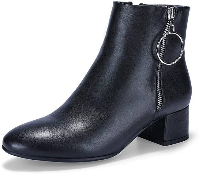 black ankle boot with block heel and circle zipper pull