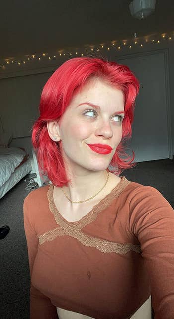 reviewer wearing bright red lipstick