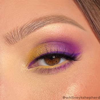 an eye with eye makeup the colors of the Lakers