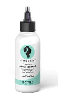 Tumeric hair detox mask in a mini bottle