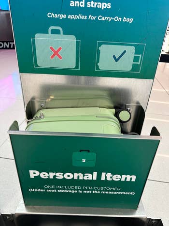 Informational sign showing acceptable size for a personal item to be included per customer for airplane carry-on, with a sample bag depicted