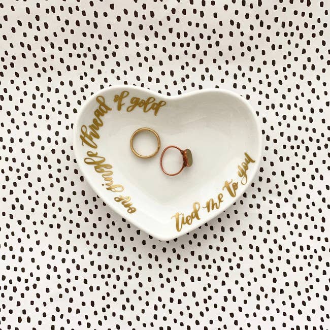 Image of the white jewelry dish with gold lettering