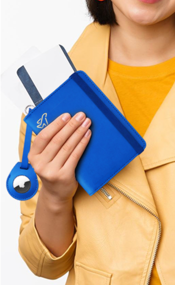 A model holding the blue passport holder