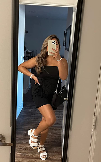 reviewer wearing the sandals in white