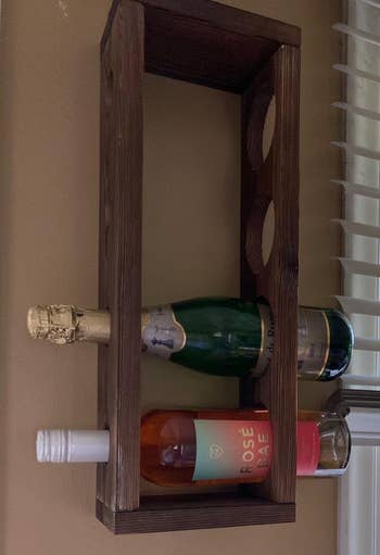 Reviewer image of the wooden rack with two bottles