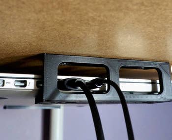 Closeup of the holes in the brackets allowing space for chargers 