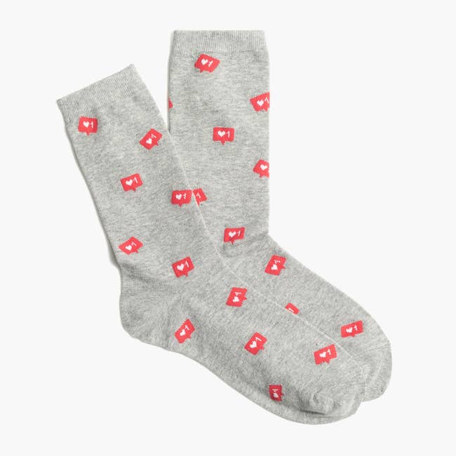 gray socks printed with red instagram-inspired heart like notifications