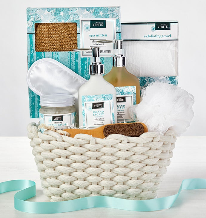a white basket filled with bath supplies