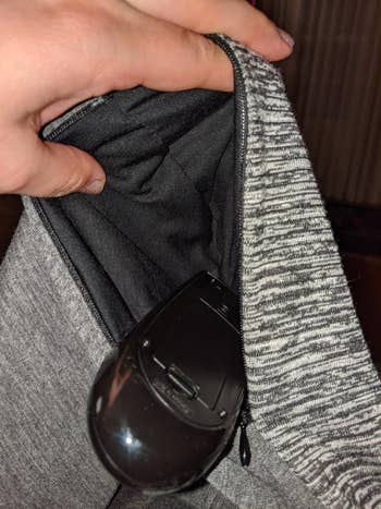 image of reviewer showing one of the pockets in the scarf
