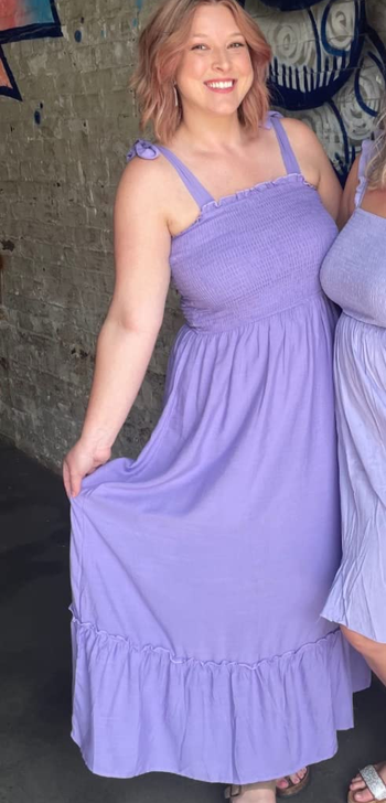 reviewer wearing the purple dress