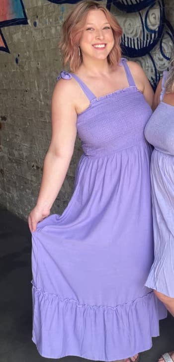 reviewer wearing the purple dress