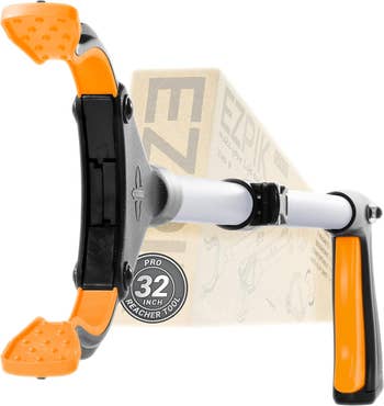 EZPIK Pro 32-inch reacher tool with ergonomic handle and rubber grippers, designed for easy picking and grabbing. Packaged for retail display