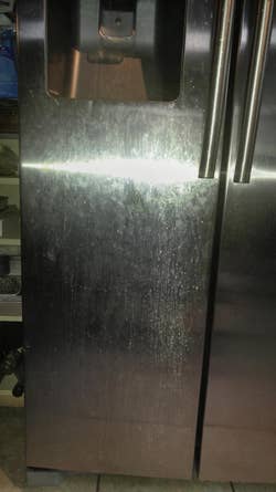 reviewer's stained fridge door