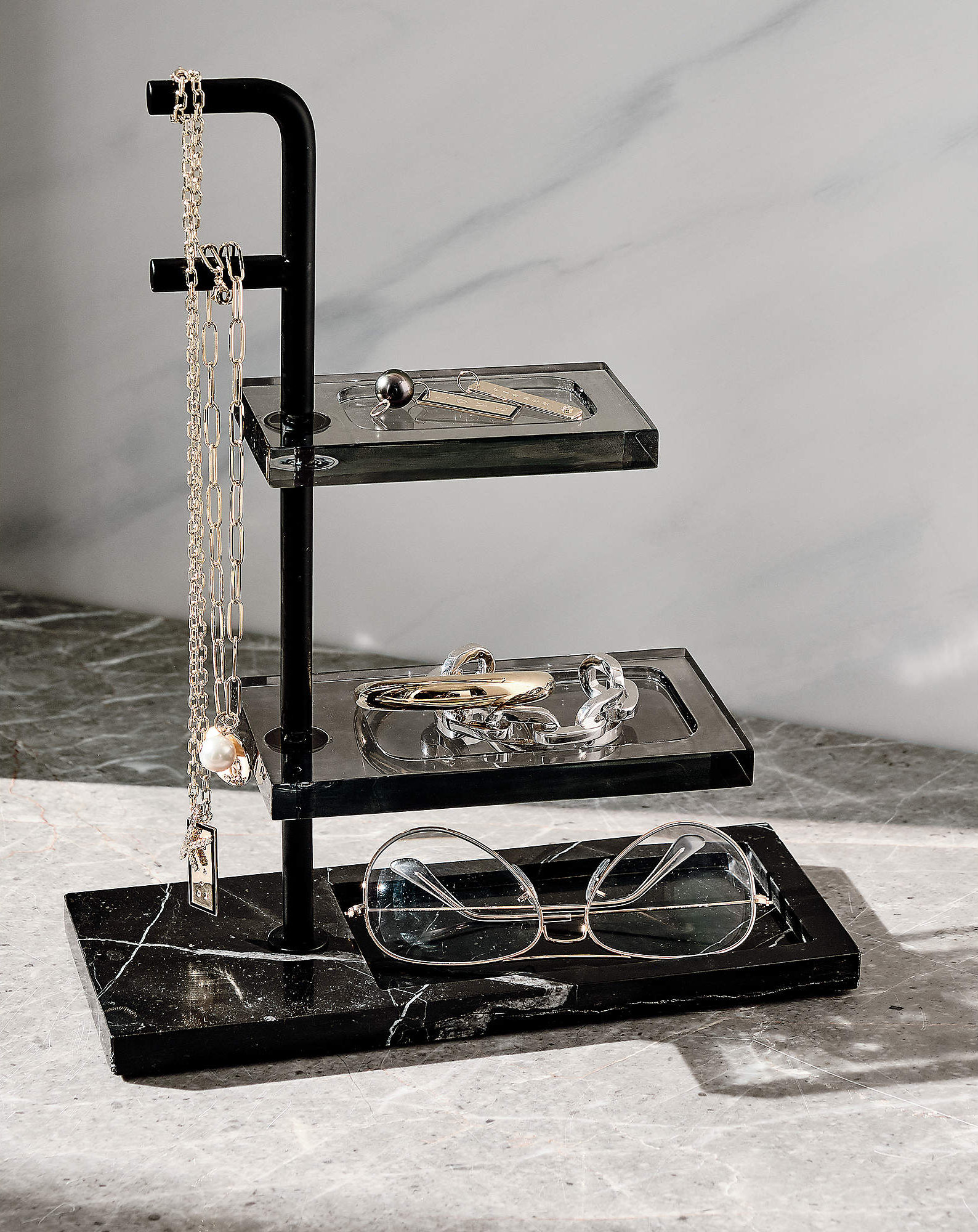 black marble organizer with three tiers