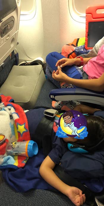 reviewer image showing two kids using the footrest on a plane