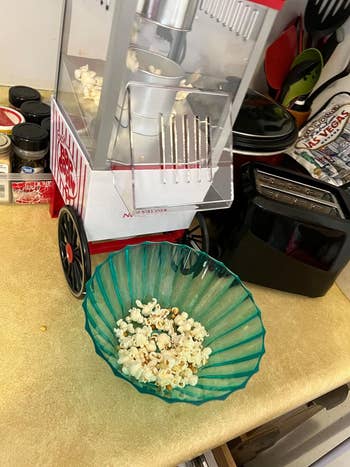 Popcorn instrumentality   with a fewer  popped kernels successful  a solid  bowl