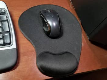reviewer photo of black mouse pad with wrist support