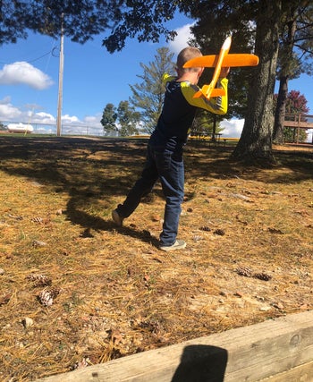 Reviewer's photo of a child launching a foam plane