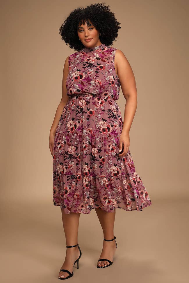 model wearing mauve midi dress with flowers