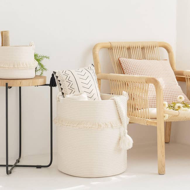 Boho-style living space with a tassel-trimmed basket for storage