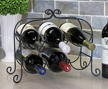 Image of black wine rack with bottles