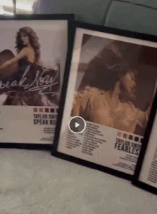 a gif of framed taylor swift posters
