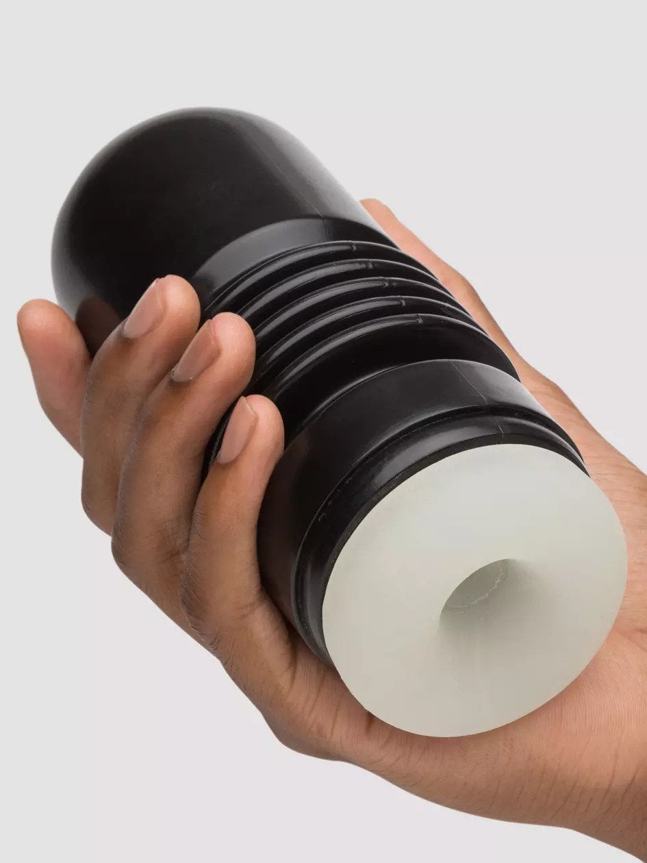 Model holding black stroker with transparent sleeve