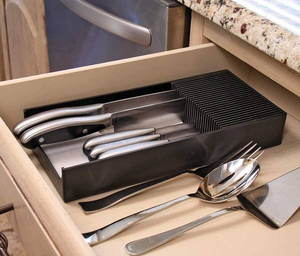 organizer in drawer holding different sized knives