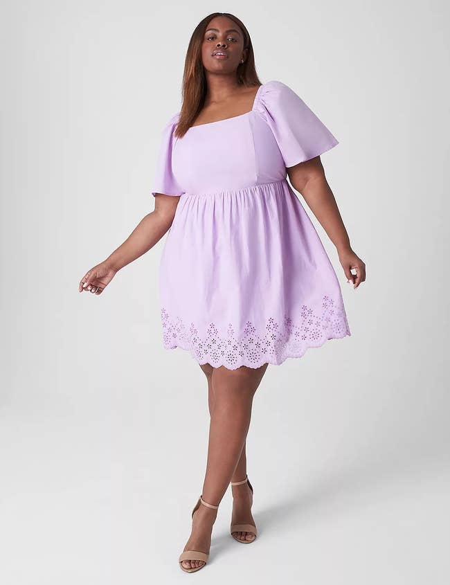 model in square neck above the knee lavender dress with flare short sleeves