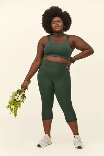 model wearing the leggings in dark green