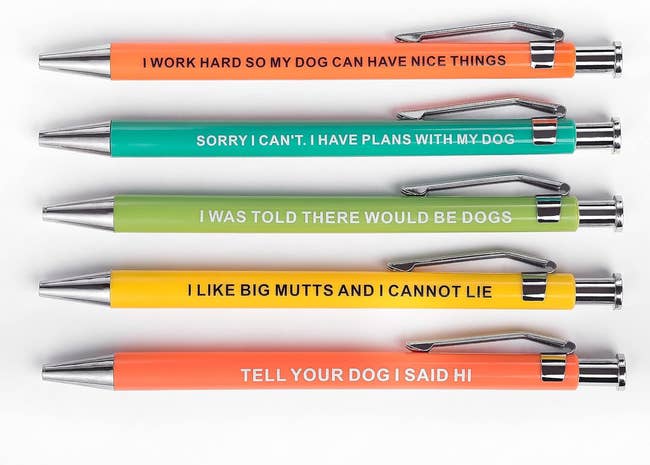 five pens with dog people sayings on them
