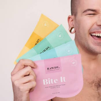 a model holding four butt sheet mask packs 