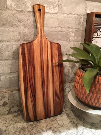 a reviewer's board standing up on their kitchen counter