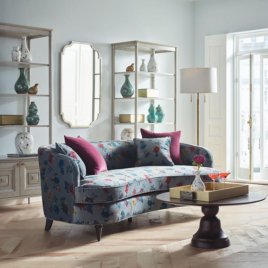 floral pattern sofa in kidney bean shape with single seating cushion