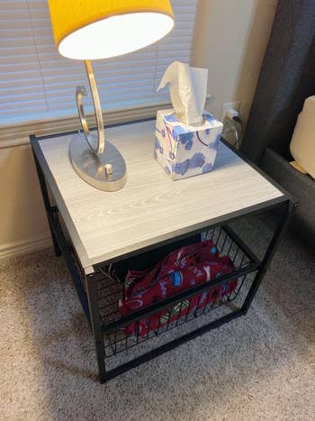 reviewer image of the end table with basket underneath it