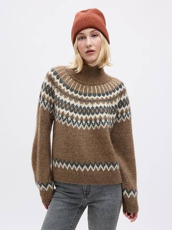 a model in a brown fair isle sweater